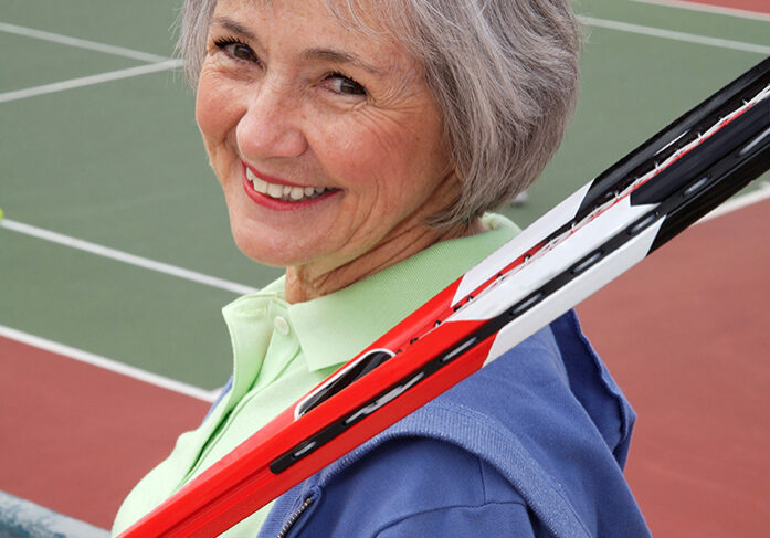 Active Senior Playing Tennis